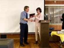 Arthur Calhoun receives the 2017 “Citizen of the Year” award from Debbie Montoya, a representative of the governor, for his medical services and volunteer work in Doddridge County, West Virginia.